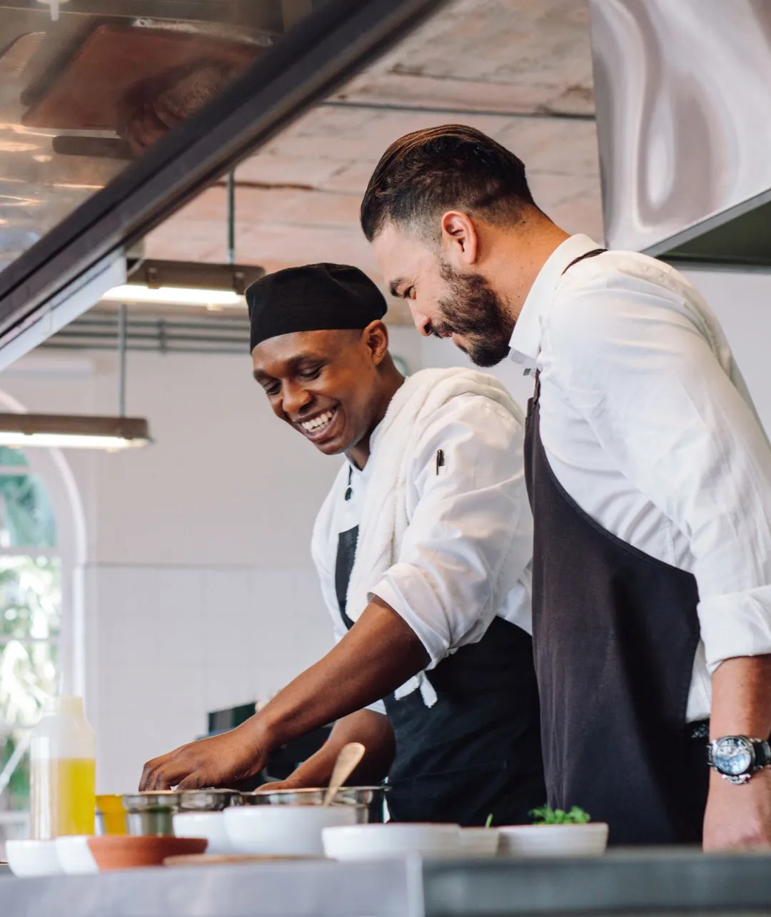 Two men cooking