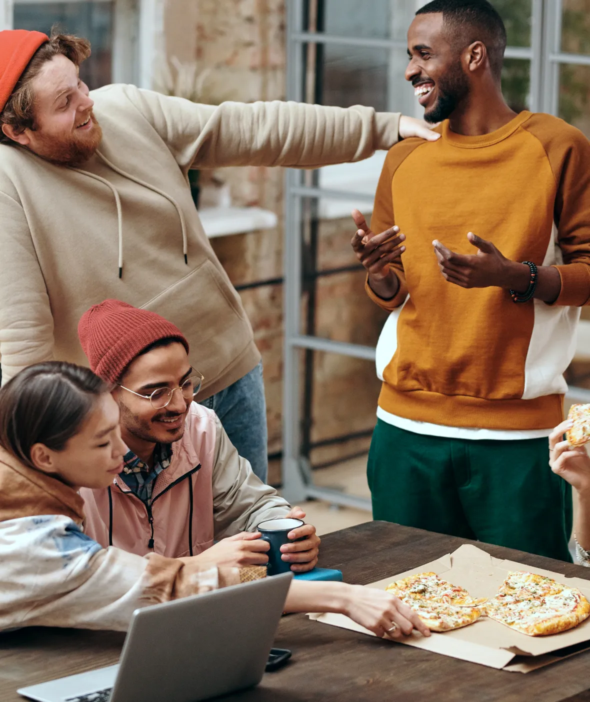 People at restaurant having fun and Pizza
